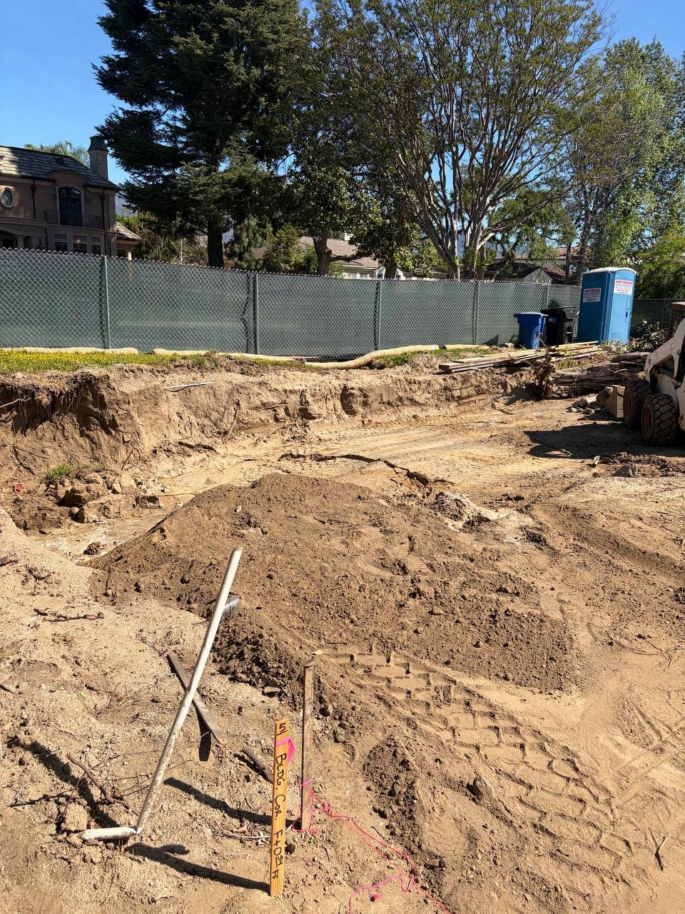 Breaking Ground: Excavation and Survey Stakes on an Arcadia 