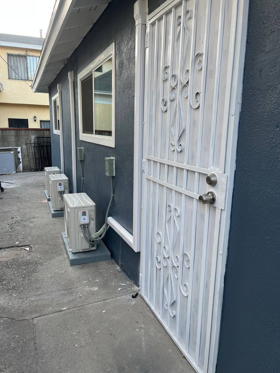 Exterior renovation – navy stucco with mini-splits, Arcadia CA